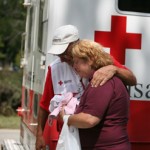 m36840110 red cross volunteer hugs woman next to erv 247x261